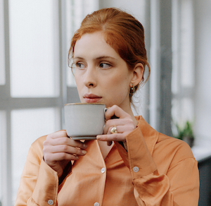 woman with coffee | MiddleWeb